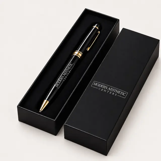 Black and gold metal pen in a black branded presentation case